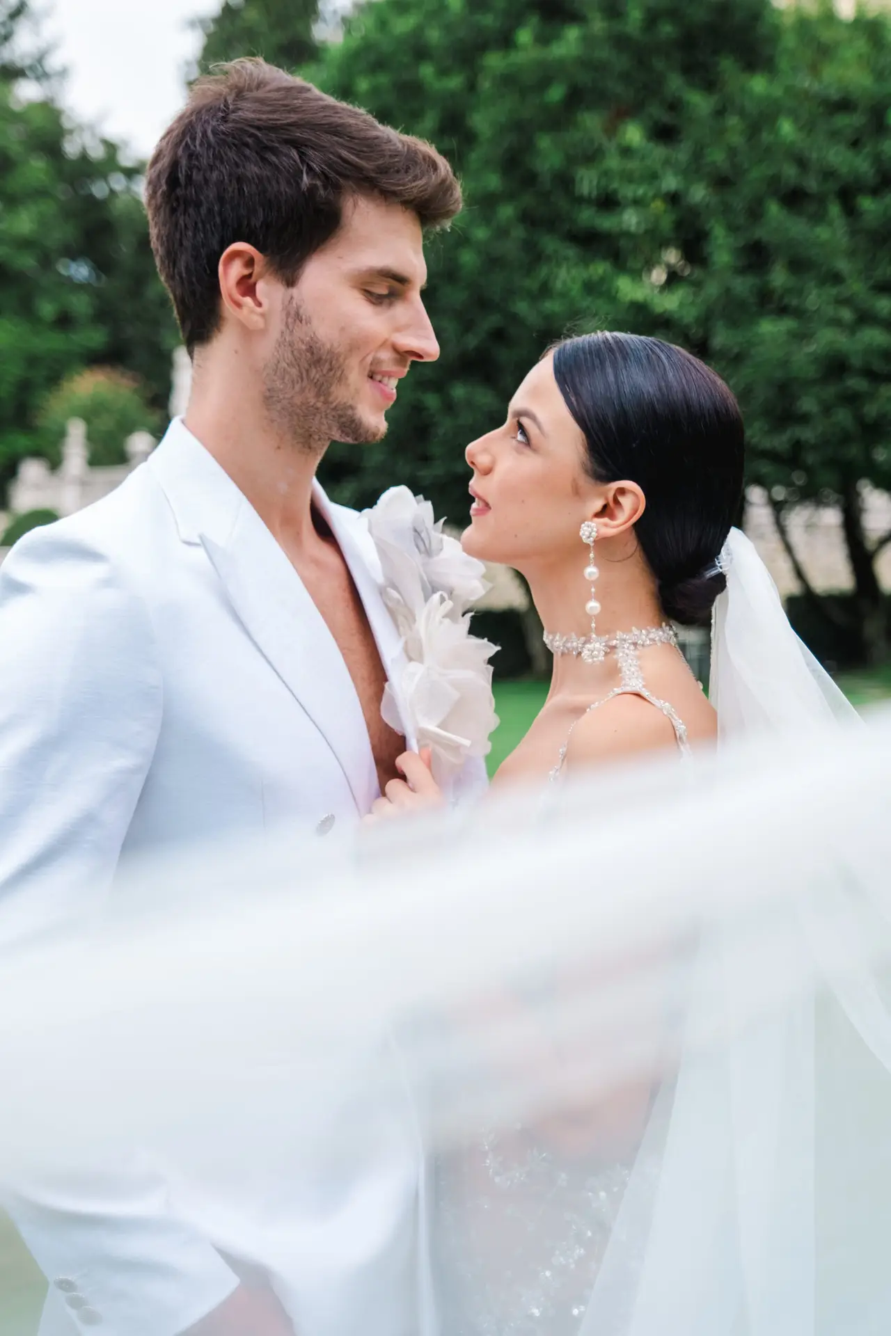 Bride and groom with vintage black convertible at Villa Canton, Milan