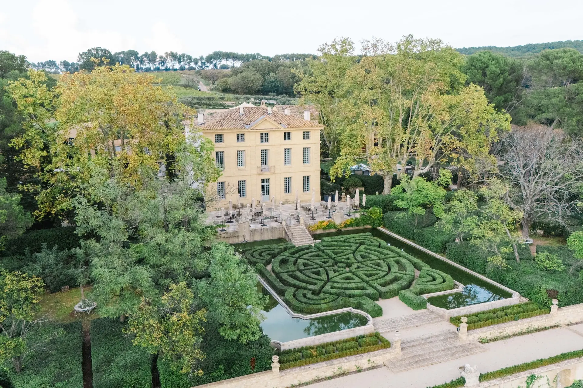 Luxury wedding venue Château de la Gaude in Provence, featuring formal gardens and elegant architecture, captured by wedding photographer Julien Boyer.