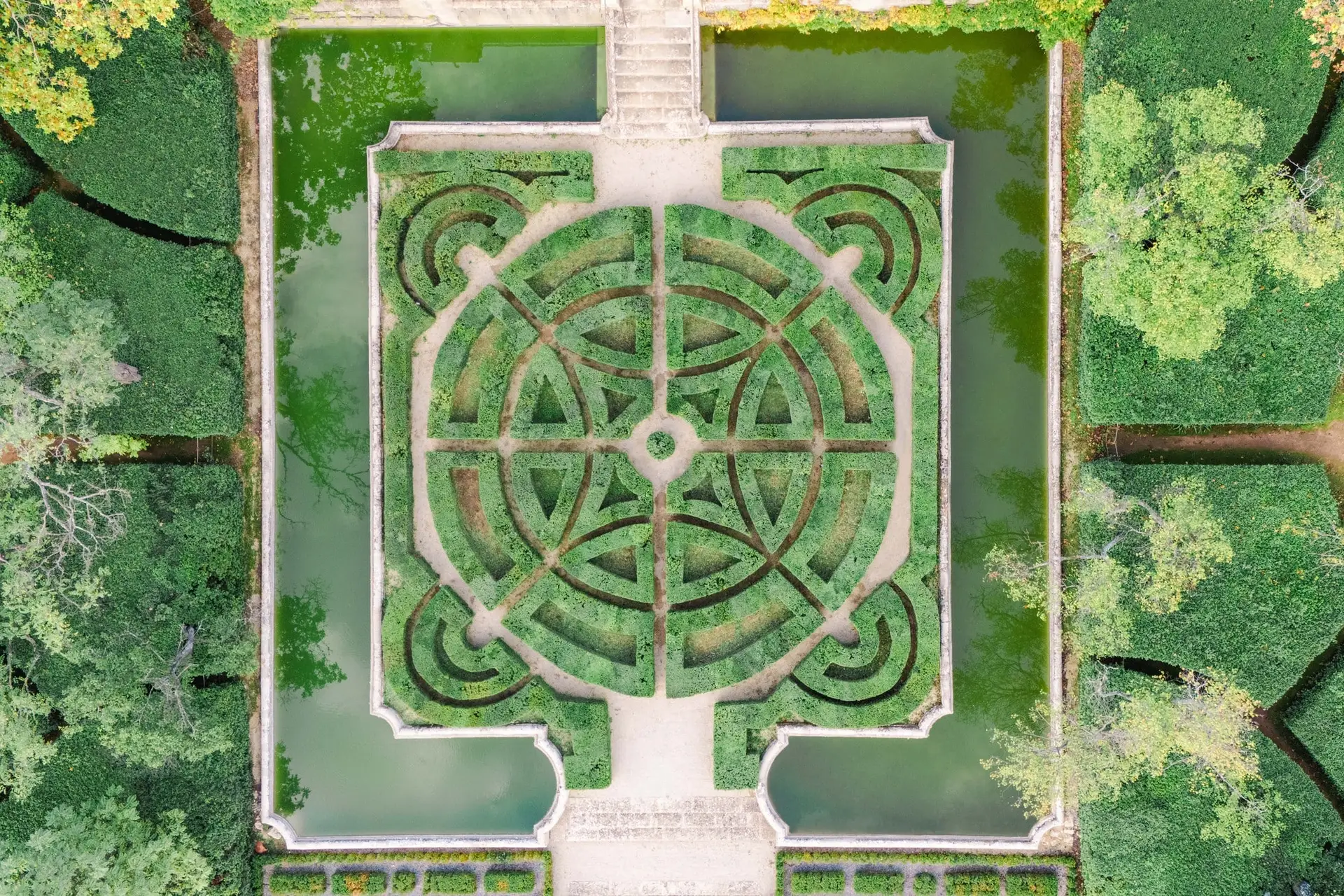 Symmetrical French garden with geometric hedge design, viewed from above at Château de la Gaude.