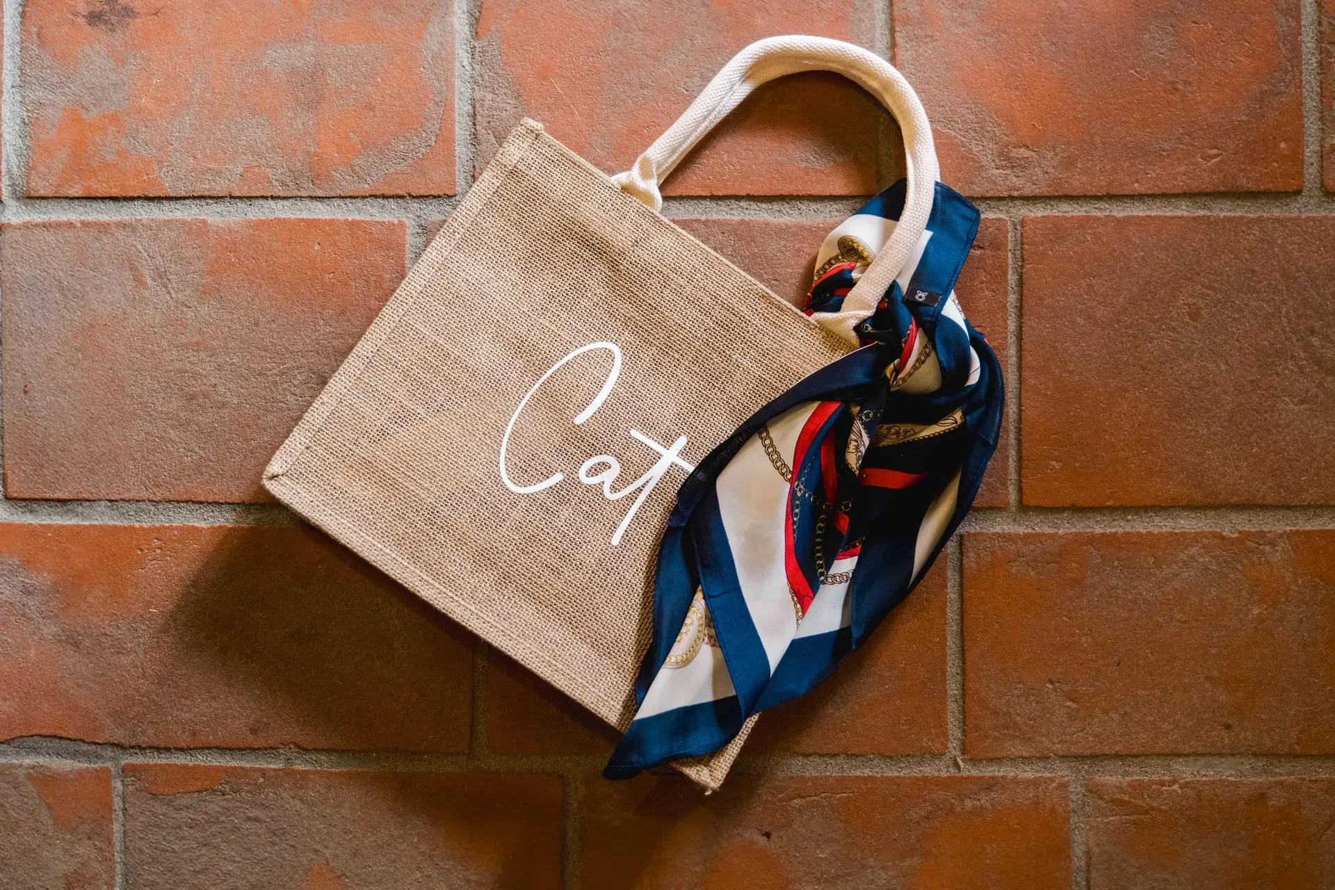 Personalized wedding guest gift bag with silk scarf detail, prepared for a destination wedding at Borgo Corsignano in Tuscany, Italy
