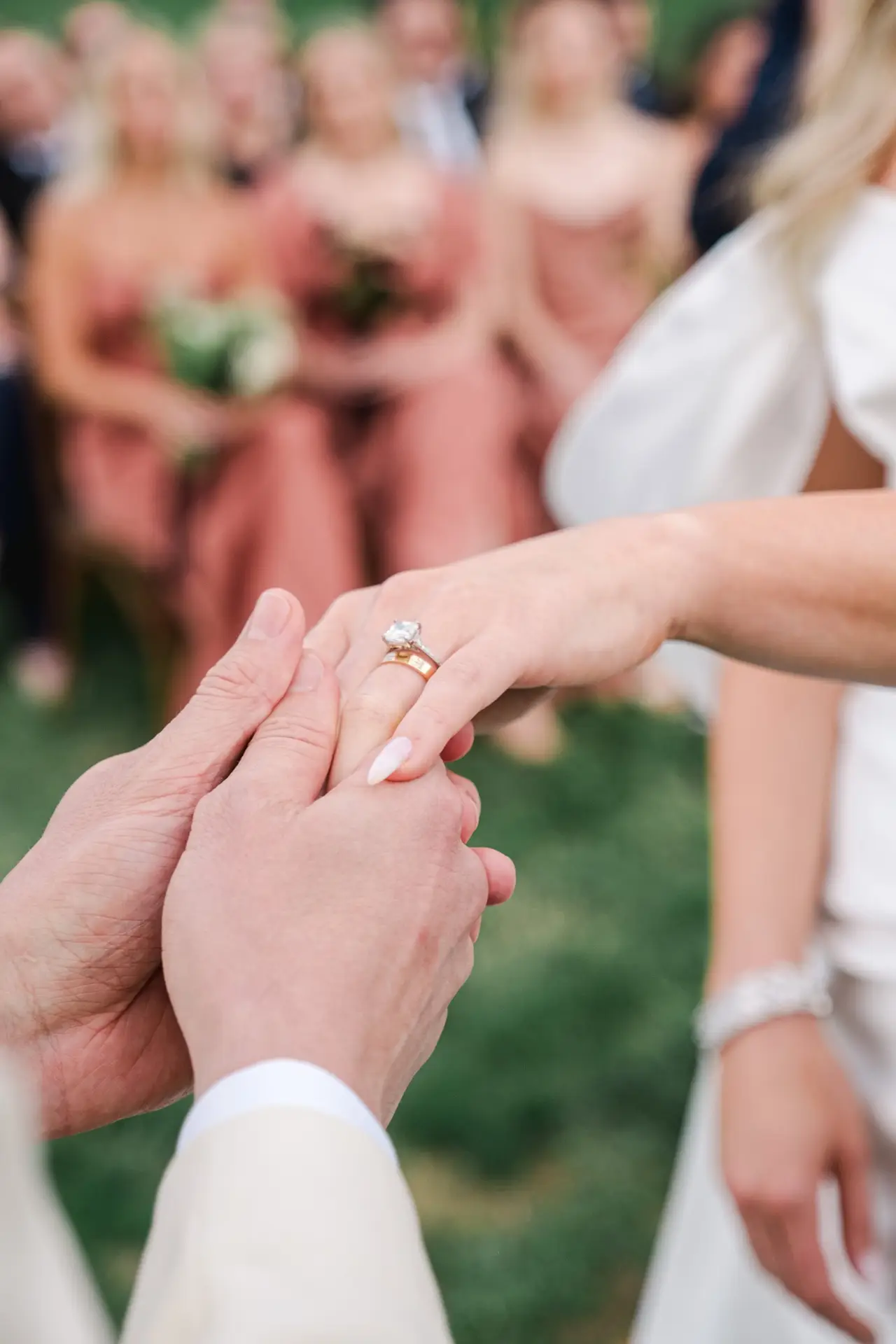 A close-up of forever — the bride’s dazzling engagement ring and wedding band, a timeless symbol of luxury and love, photographed by Julien Boyer.